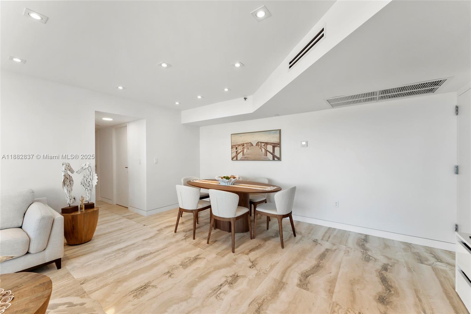 5900 Collins Avenue, Unit 604 Miami Beach, FL 33140 - Photo 15 of 30 a view of a room with furniture and wooden floor