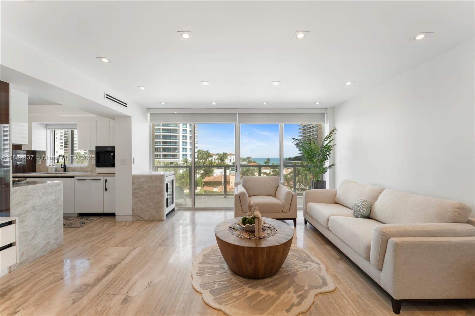 5900 Collins Avenue, Unit 604 Miami Beach, FL 33140 - Photo 16 of 30 a living room with furniture and a large window