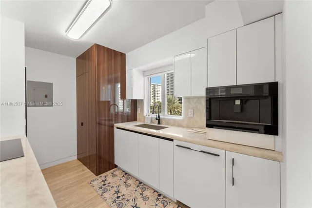 a kitchen with stainless steel appliances kitchen island granite countertop a sink and stove