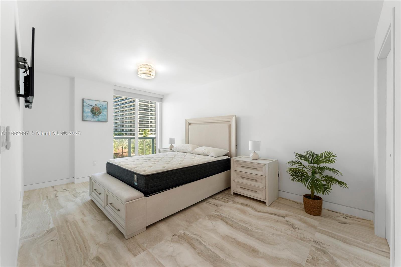 5900 Collins Avenue, Unit 604 Miami Beach, FL 33140 - Photo 21 of 30 a living room with furniture and a potted plant