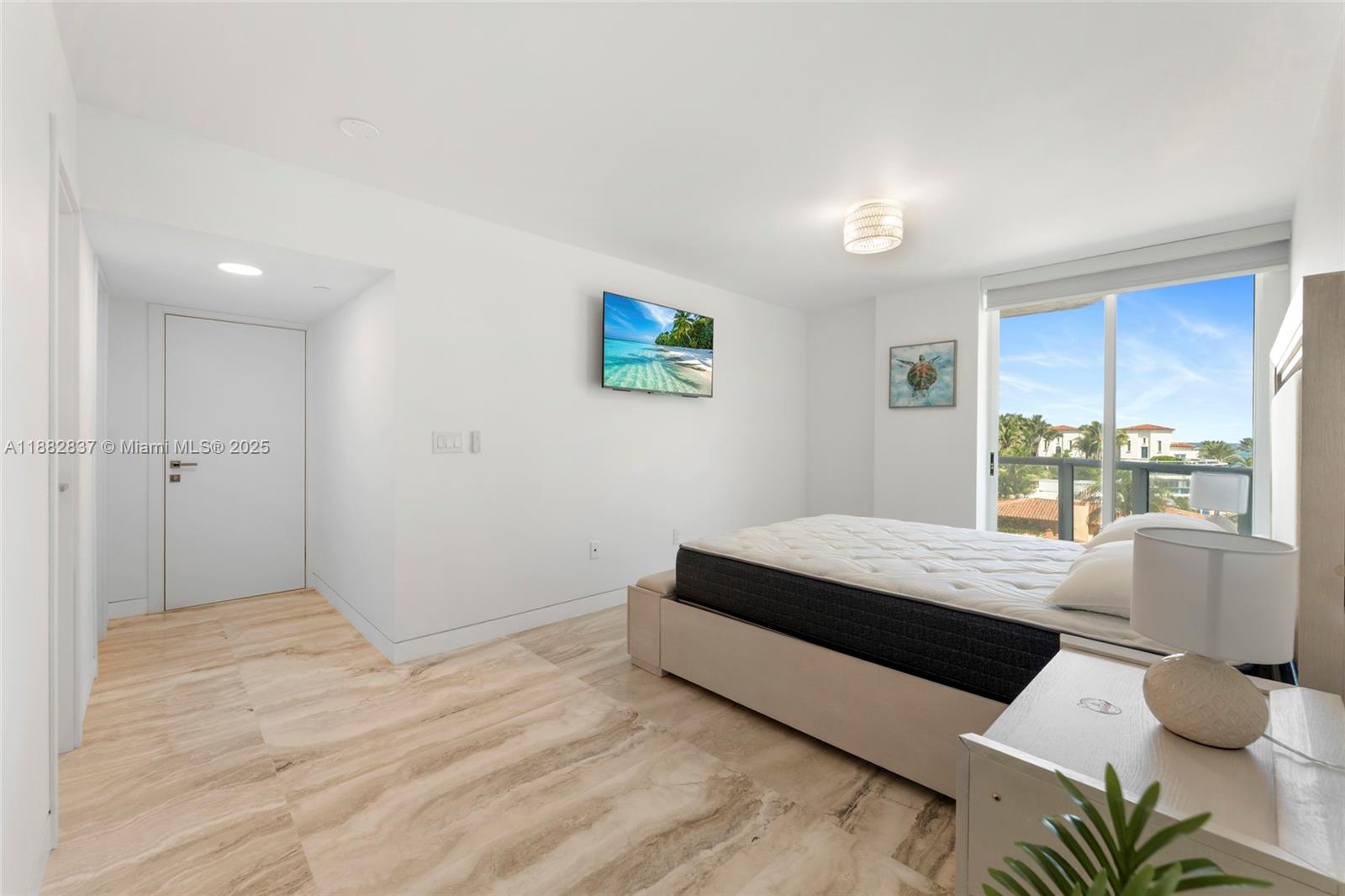 5900 Collins Avenue, Unit 604 Miami Beach, FL 33140 - Photo 22 of 30 a living room with furniture and a large window
