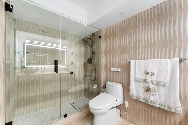 a room with a bed and large window