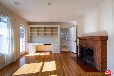 a front view of a house with wooden floor