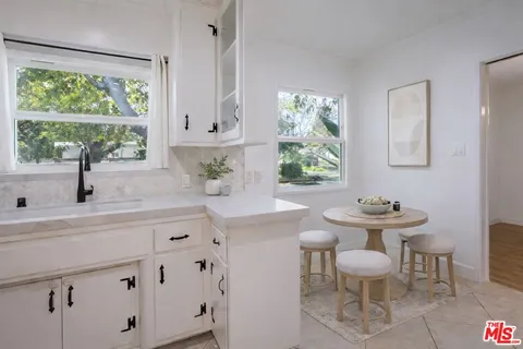 a kitchen with a sink and a window