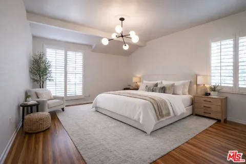 a bedroom with bed and window