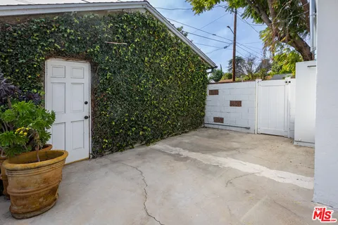 a view of a backyard of the house