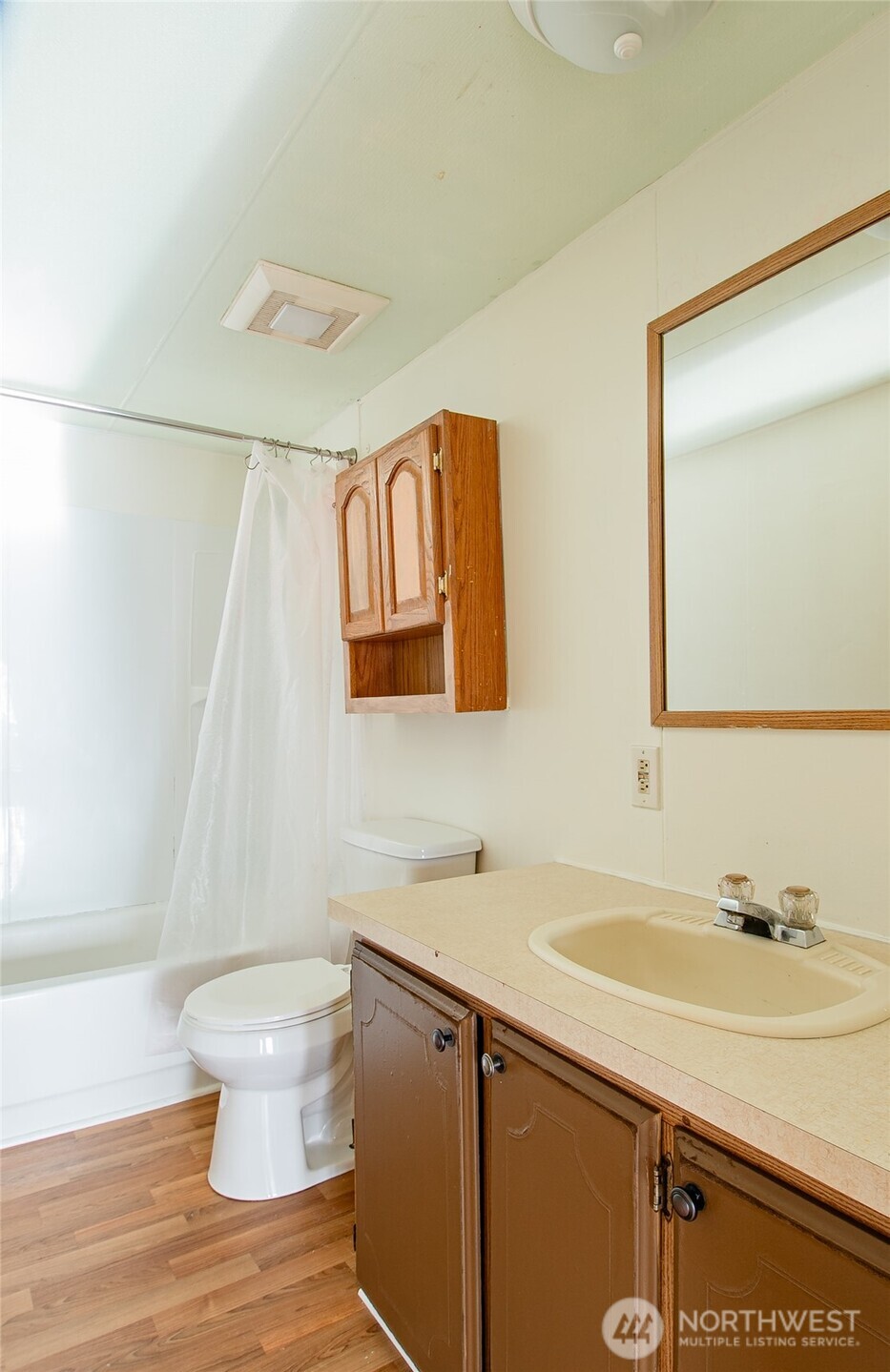5541 Bayvue Road Blaine, WA 98230 - Photo 11 of 14 a bathroom with a sink a toilet and a mirror