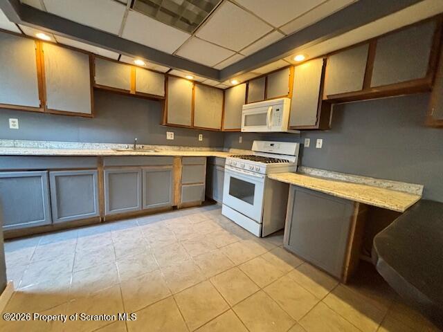 72 Spring Street Carbondale, PA 18407 - Photo 2 of 10 a kitchen with stainless steel appliances granite countertop a sink a stove and cabinets