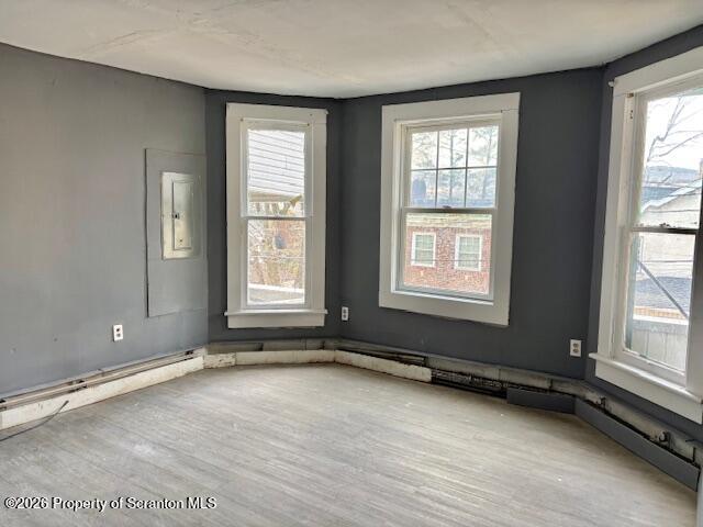72 Spring Street Carbondale, PA 18407 - Photo 3 of 10 wooden floor and window in an empty room