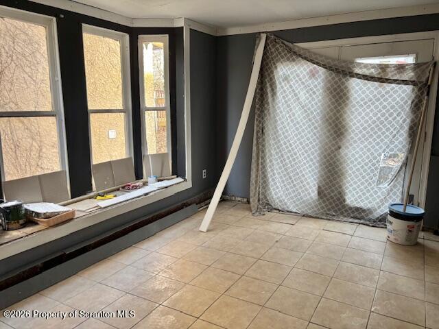 72 Spring Street Carbondale, PA 18407 - Photo 4 of 10 a living room with a bed and a table
