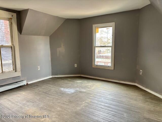 72 Spring Street Carbondale, PA 18407 - Photo 6 of 10 an empty room with wooden floor and windows