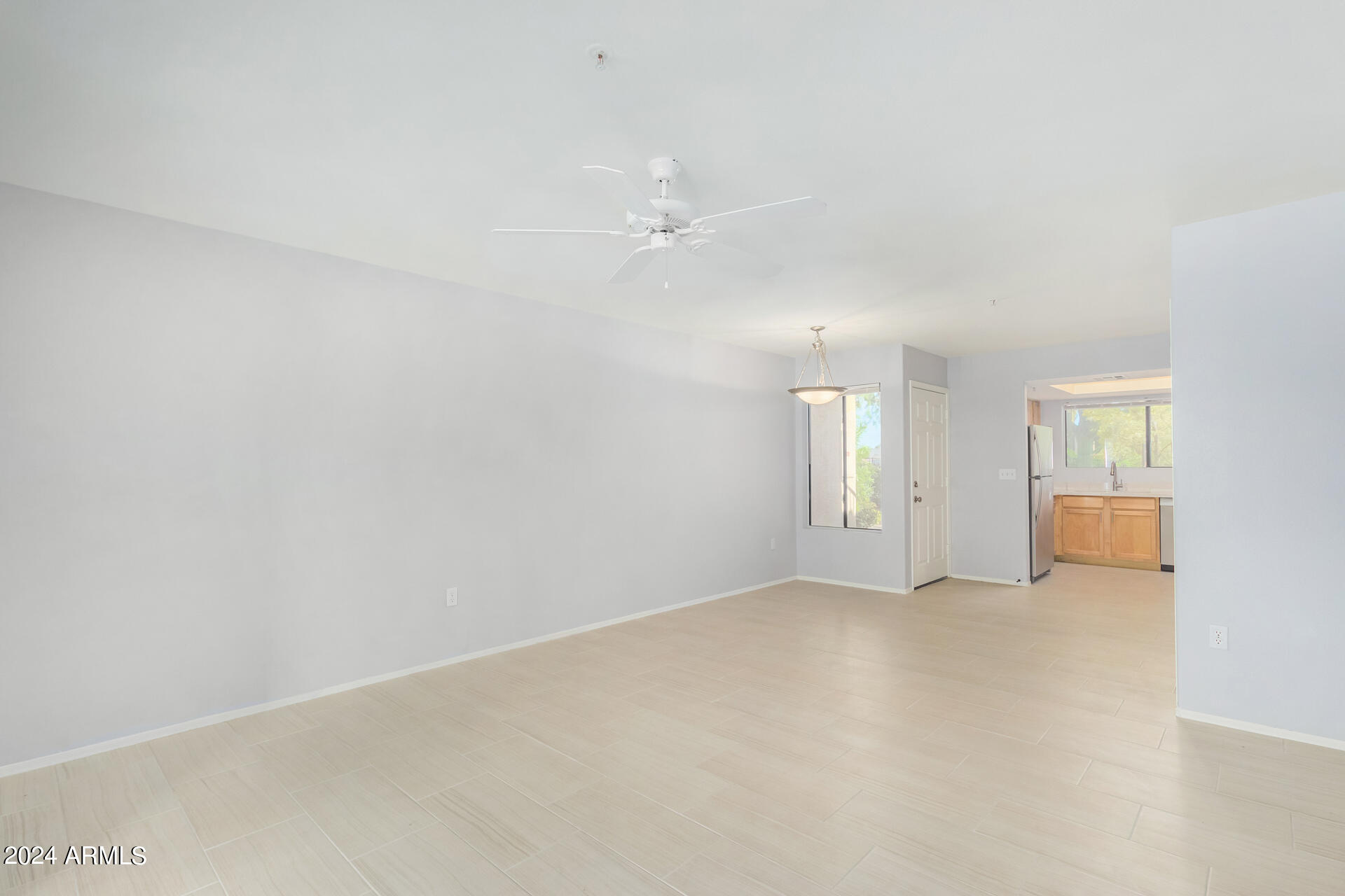 9990 North Scottsdale Road, Unit 1030 Paradise Valley, AZ 85253 - Photo 11 of 40 an empty room with windows and ceiling fan