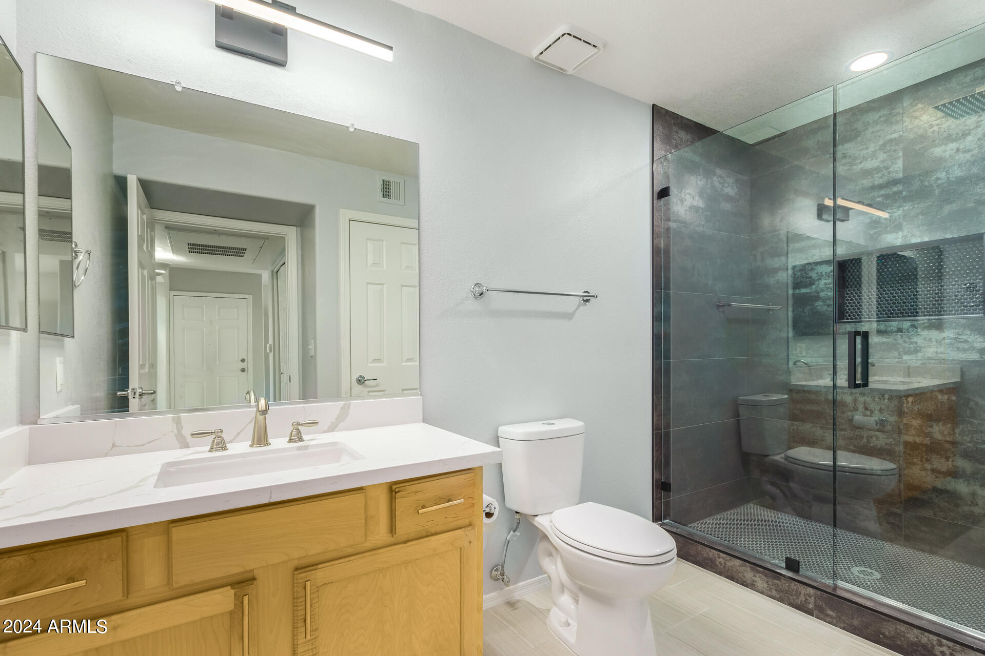 9990 North Scottsdale Road, Unit 1030 Paradise Valley, AZ 85253 - Photo 26 of 40 a bathroom with a sink toilet and shower