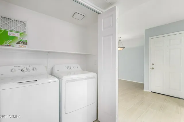 a view of storage room with washer and dryer