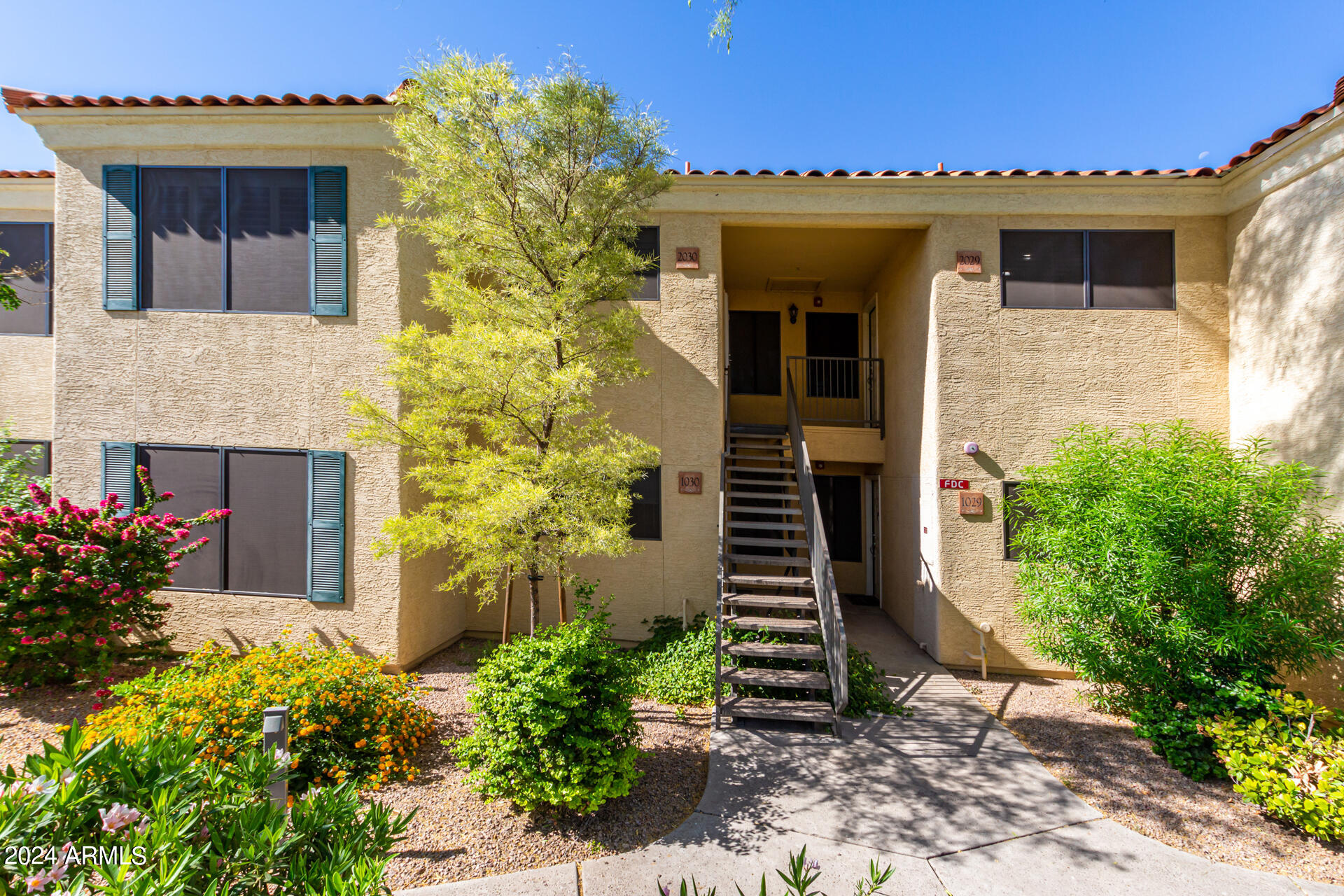 9990 North Scottsdale Road, Unit 1030 Paradise Valley, AZ 85253 - Photo 7 of 40 a view of a house with potted plants