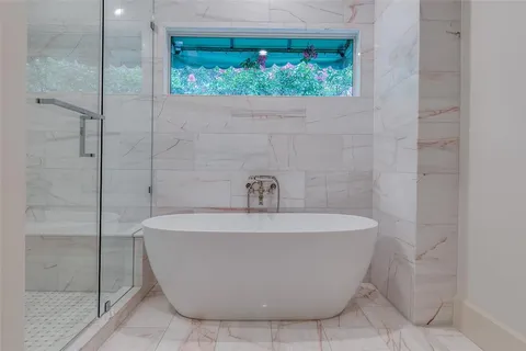 a white bath tub sitting in a bathroom