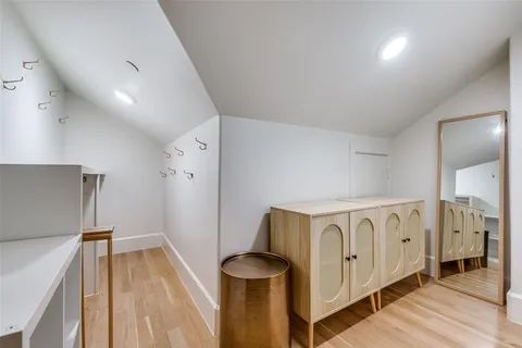 a view of an entryway with wooden floor