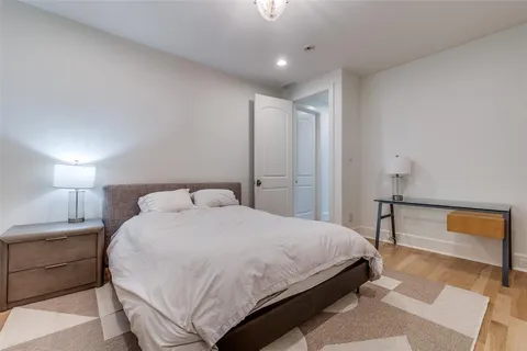 a bedroom with a bed and a lamp