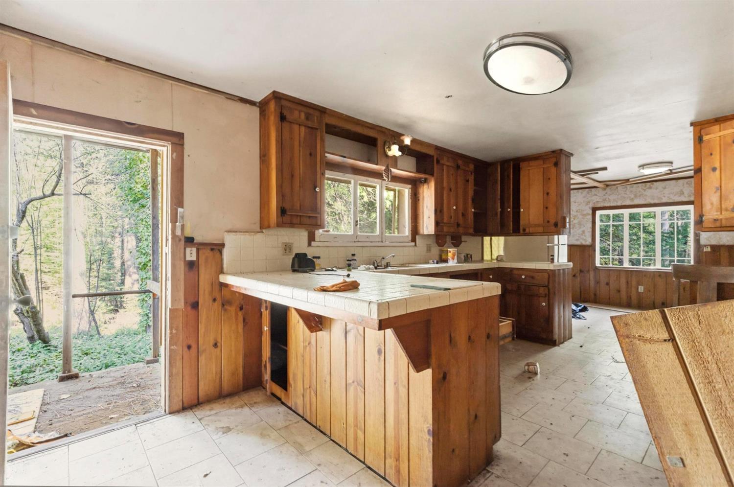 13887 La Porte Road Strawberry Valley, CA 95981 - Photo 14 of 37 a kitchen with a sink stove and cabinets