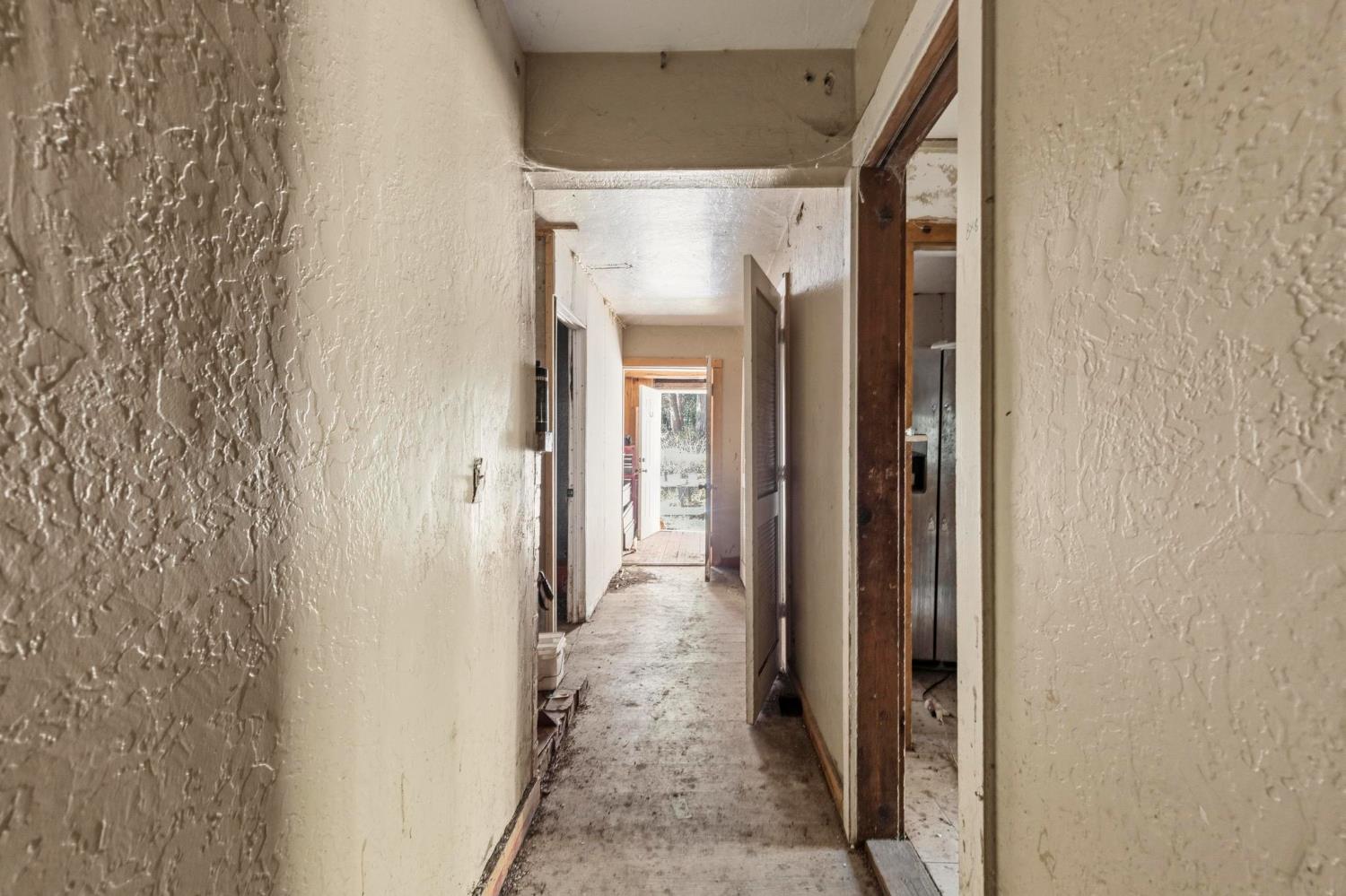 13887 La Porte Road Strawberry Valley, CA 95981 - Photo 16 of 37 a view of a hallway with a glass door and a window