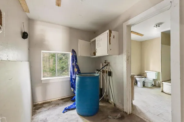 a view of an empty room with a fireplace
