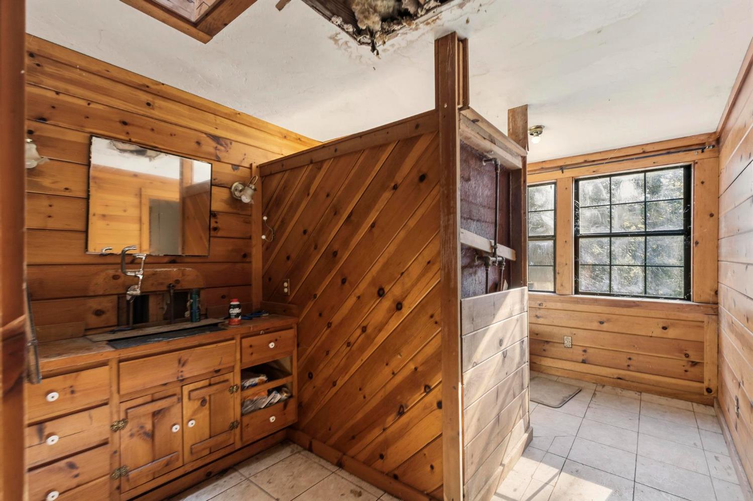 13887 La Porte Road Strawberry Valley, CA 95981 - Photo 23 of 37 a bathroom with a sink a vanity and a large mirror