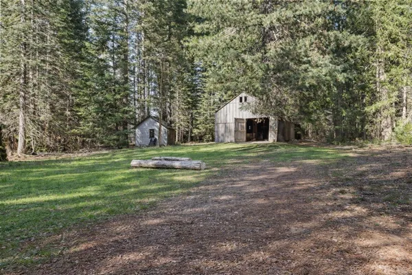 a view of balcony with wooden floor and mountain view
