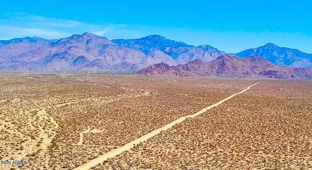 a view of a backyard with a lake view