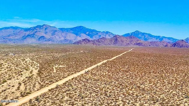 a view of mountain with a lake view