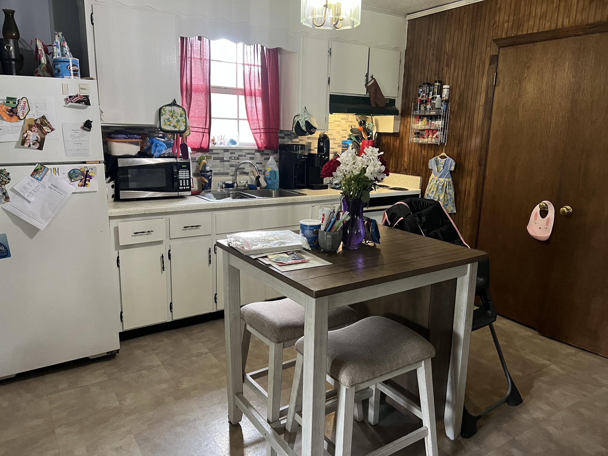 121 Dell Road Gruetli Laager, TN 37339 - Photo 3 of 14 a kitchen with a table chairs stove and cabinets