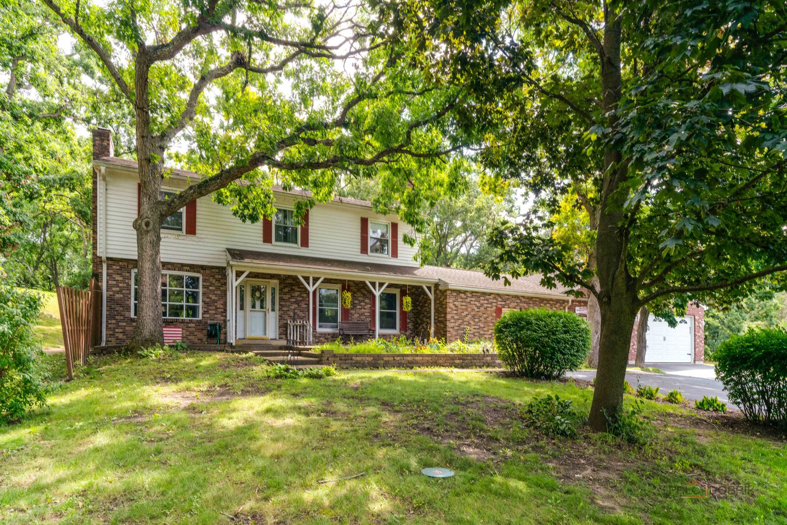 front view of a house with a yard