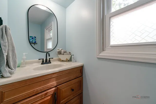 a bathroom with a sink and a mirror