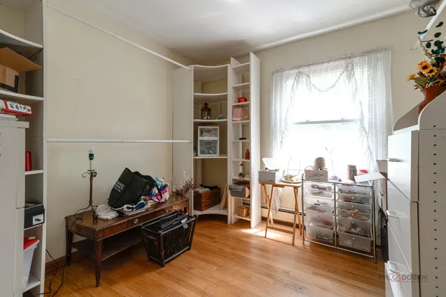 a living room with furniture a rug and a window