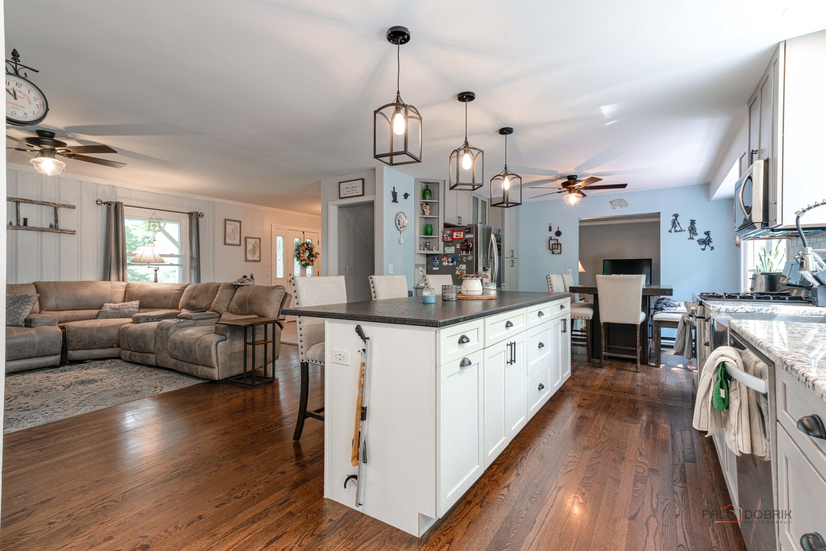 820 Black Partridge Road McHenry, IL 60051 - Photo 8 of 34 a large living room with fireplace furniture and a wooden floor