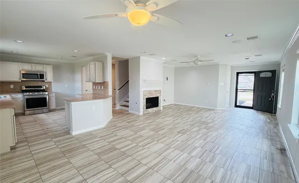 a view of a kitchen with a stove cabinets and wooden floor