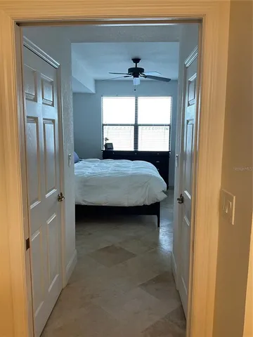 a bathroom with a granite countertop toilet a sink and shower