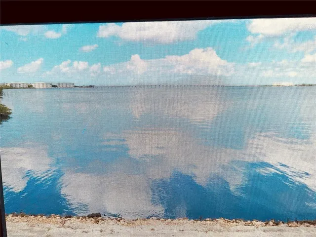 a living room with furniture and a garden