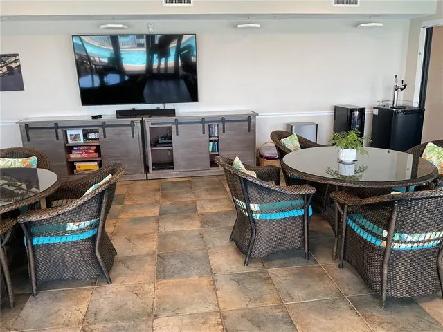 a lawn chair sitting in a room next to a chair