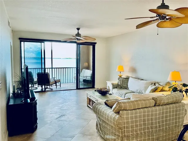 a view of a kitchen with a sink and wooden cabinets