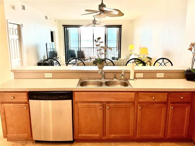 a kitchen with stainless steel appliances granite countertop a sink and cabinets