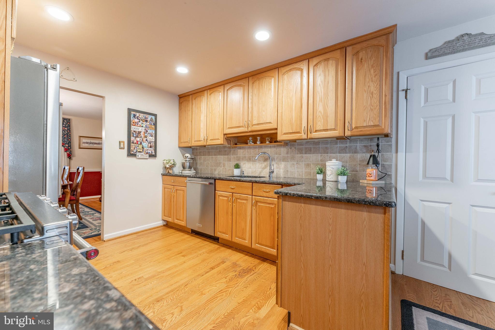 209 Beechtree Drive Broomall, PA 19008 - Photo 20 of 61 a kitchen with stainless steel appliances granite countertop a refrigerator sink and cabinets