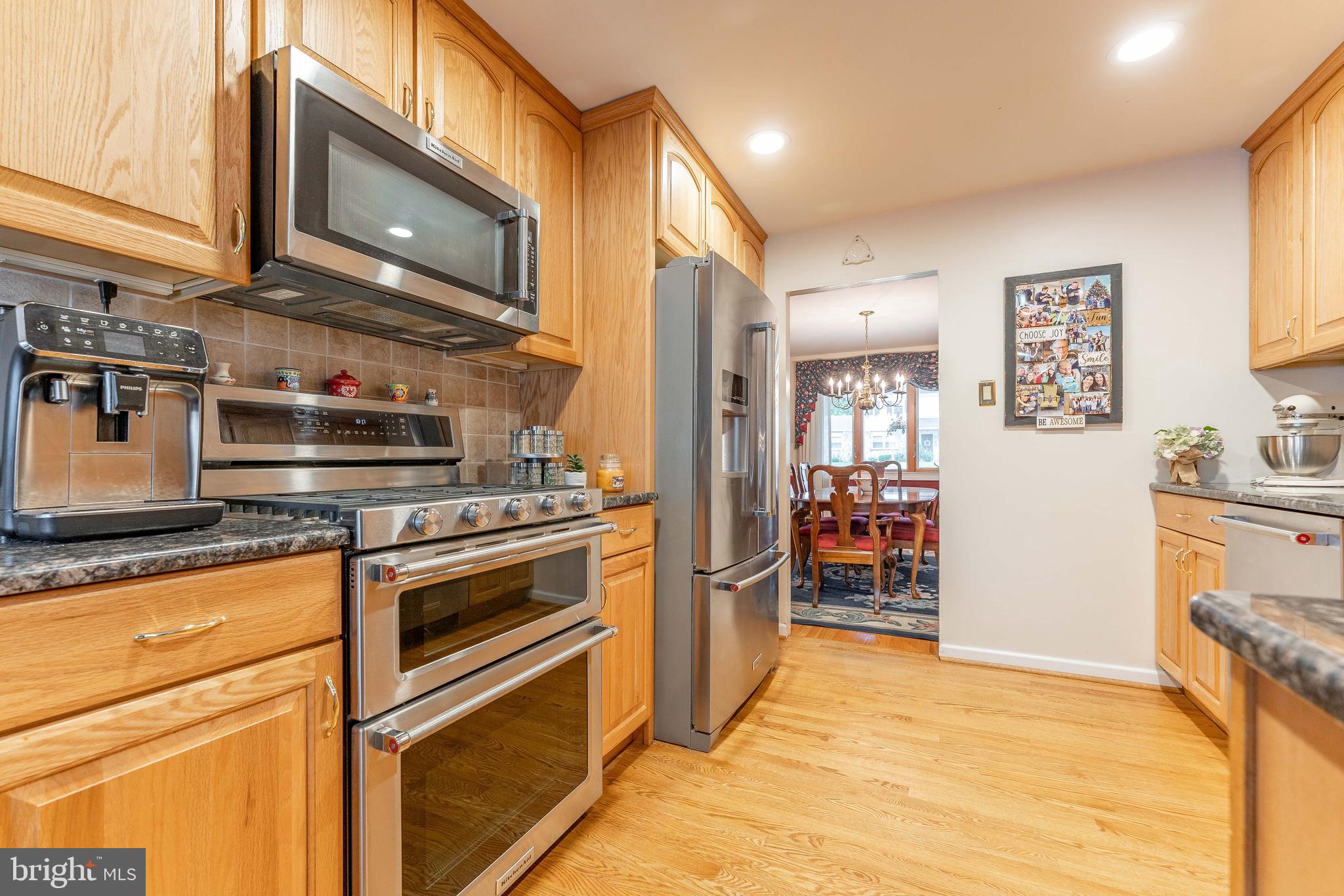 209 Beechtree Drive Broomall, PA 19008 - Photo 21 of 61 a kitchen with stainless steel appliances granite countertop a stove and a refrigerator