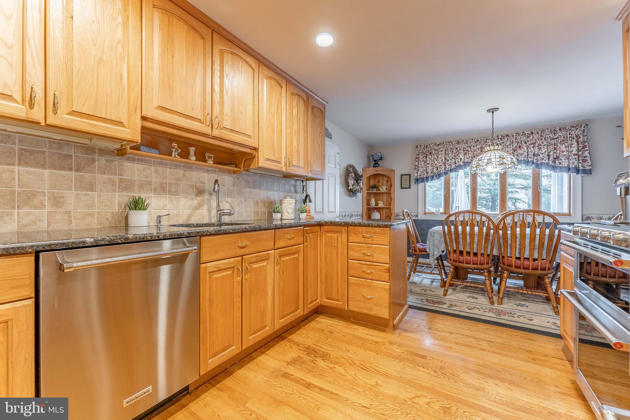 209 Beechtree Drive Broomall, PA 19008 - Photo 25 of 61 a kitchen with granite countertop a sink cabinets and outdoor space