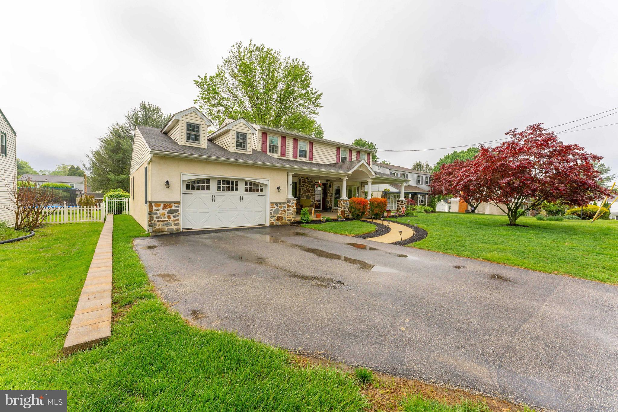 209 Beechtree Drive Broomall, PA 19008 - Photo 3 of 61 a view of a white house with a big yard and large trees