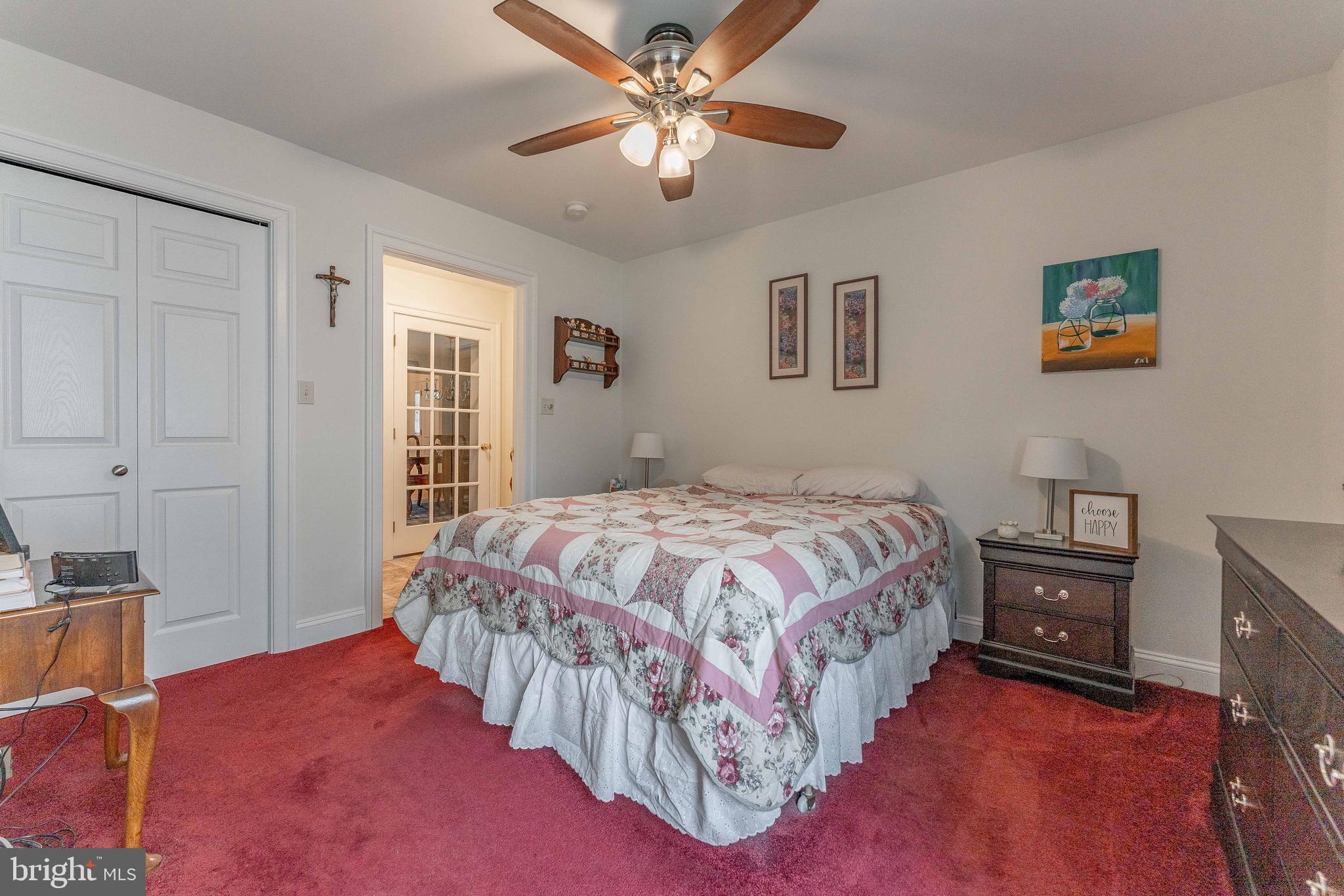 209 Beechtree Drive Broomall, PA 19008 - Photo 32 of 61 a bedroom with a bed and a chandelier