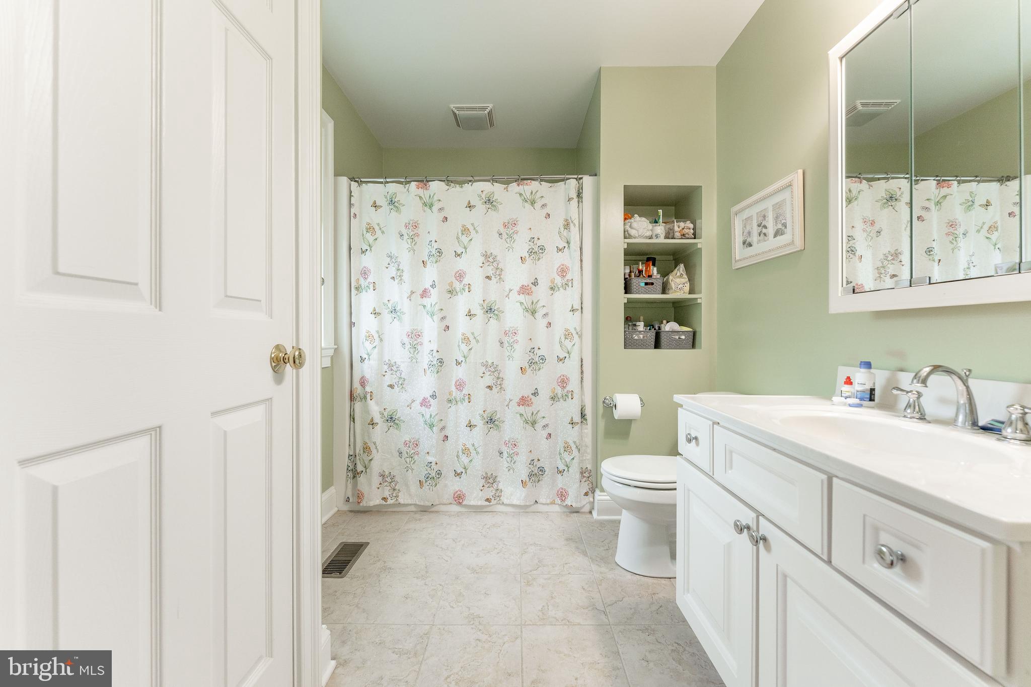 209 Beechtree Drive Broomall, PA 19008 - Photo 34 of 61 a bathroom with a sink a toilet and shower curtain