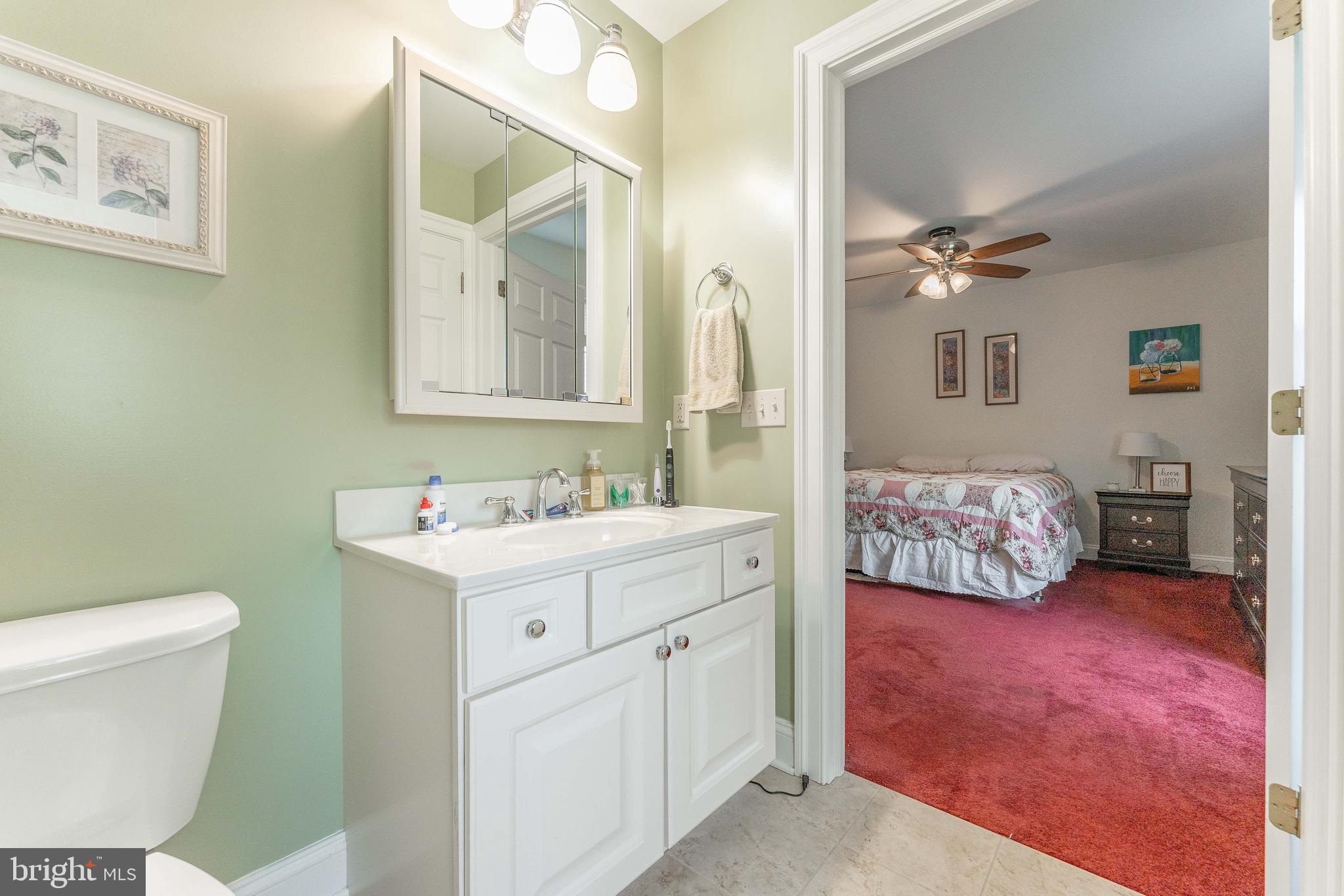 209 Beechtree Drive Broomall, PA 19008 - Photo 35 of 61 a bathroom with a toilet sink and mirror