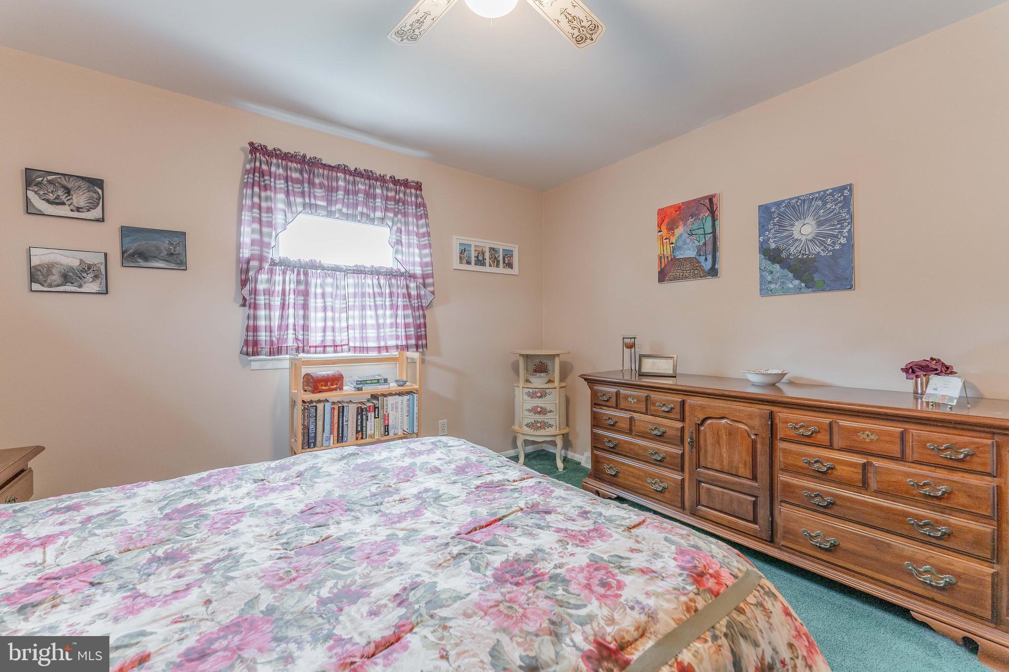 209 Beechtree Drive Broomall, PA 19008 - Photo 48 of 61 a bedroom with a bed and a dresser in it