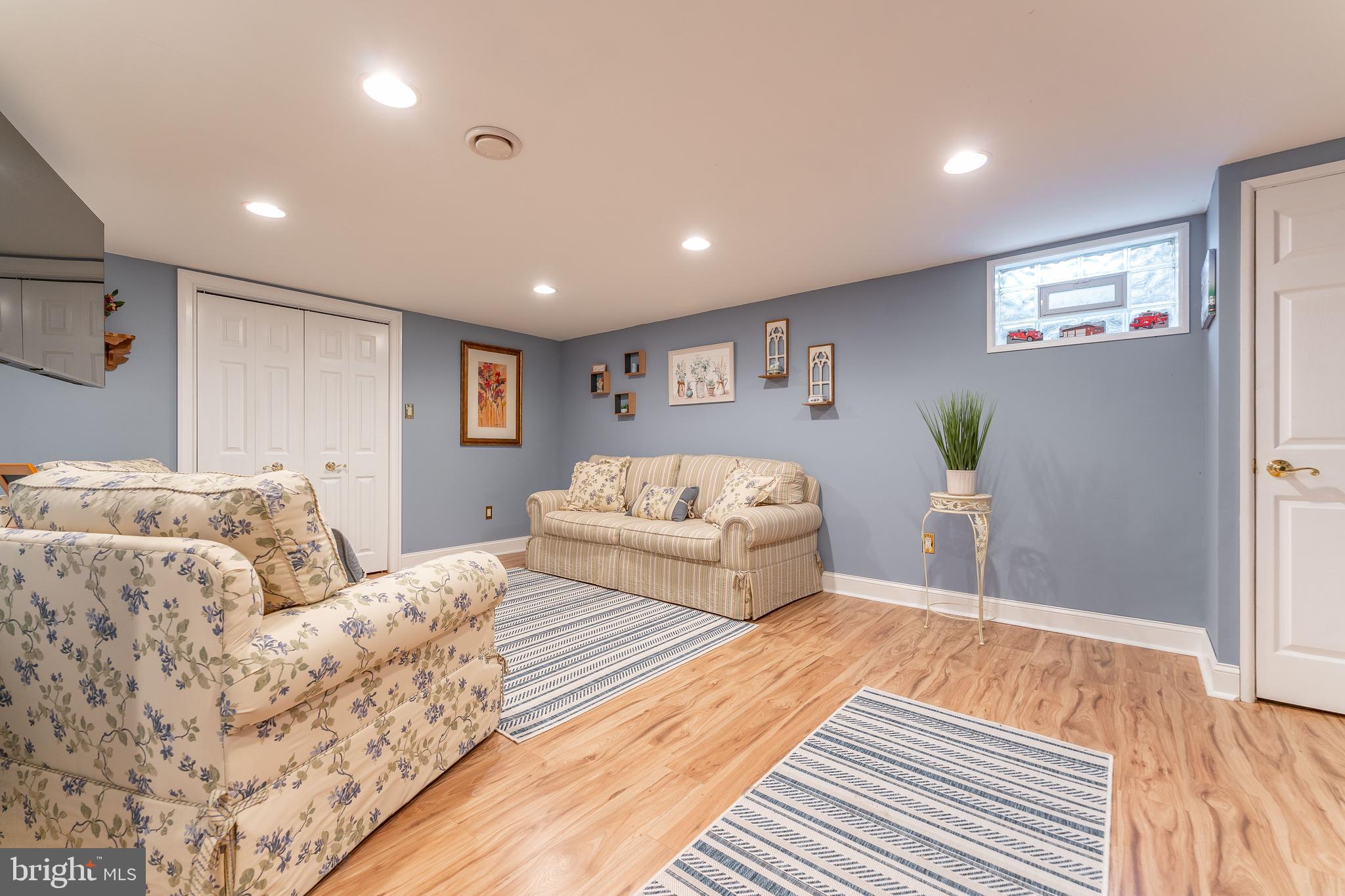 209 Beechtree Drive Broomall, PA 19008 - Photo 52 of 61 a spacious bedroom with a large bed and a couch