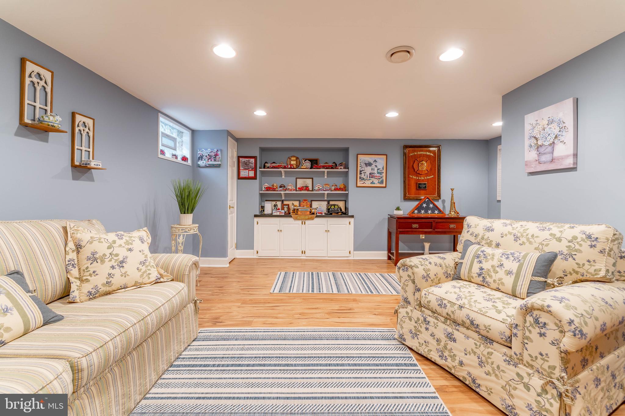 209 Beechtree Drive Broomall, PA 19008 - Photo 56 of 61 a living room with furniture and painting on the wall